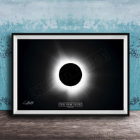 The image is a framed poster depicting a total solar eclipse, with a black background and a bright white solar disk in the center.