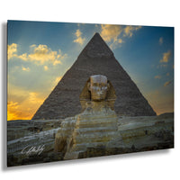 the Great Pyramid of Giza and the Sphinx, with a warm sunset sky in the background.