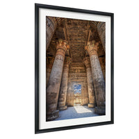 an ancient Egyptian temple with towering columns and intricate carvings, showcasing the architectural grandeur of this historical landmark.