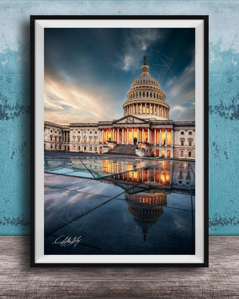 the United States Capitol building in Washington, D.C., with its iconic dome and columns illuminated against a dramatic sky.