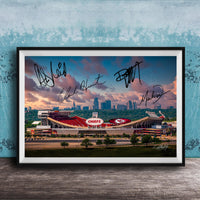 A framed photograph of a football stadium with the word "CHIEF" prominently displayed, along with the signatures of several people.