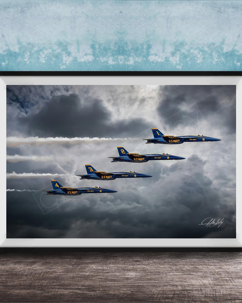 four blue and yellow fighter jets flying in formation against a cloudy sky.