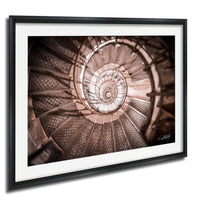 The image is a spiral staircase with a repeating pattern of steps, creating a visually striking and intricate design.