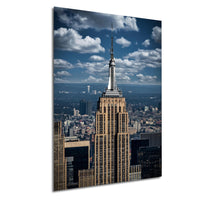 the iconic Empire State Building, a famous skyscraper in New York City, with a cloudy blue sky in the background.