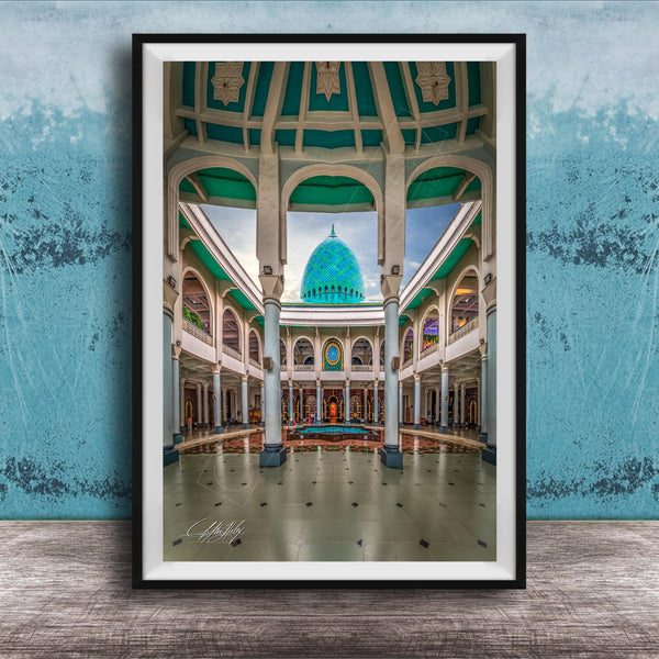 a grand, ornate building with a domed roof and arched windows, set against a blue wall.