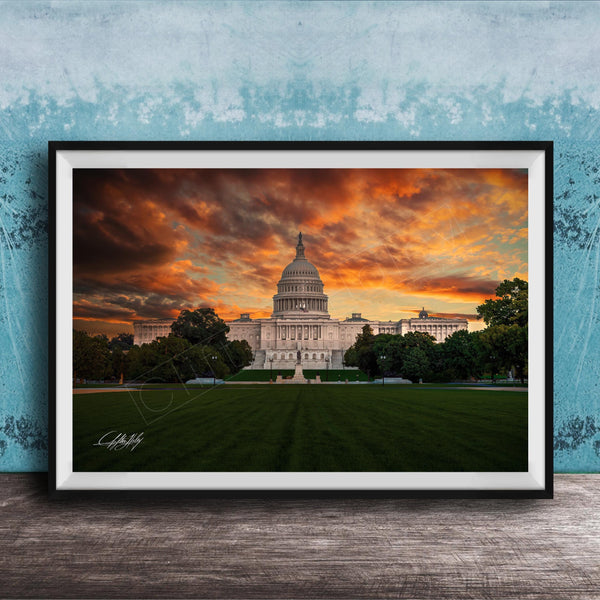 the United States Capitol building in Washington D.C. at sunset, with the Capitol's dome and surrounding architecture silhouetted against a vibrant sky filled with orange and red clouds.