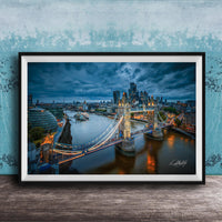 A framed photograph of the London skyline at night, featuring the iconic Tower Bridge and the River Thames.