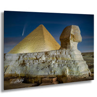 the Great Pyramid of Giza and the Sphinx, with the Great Pyramid standing tall against a starry night sky.