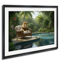 A lion sits on a wicker chair in a lush, tropical garden, with a body of water and palm trees in the background.
