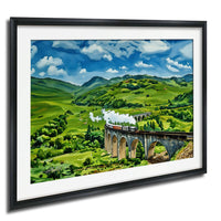 A framed painting depicting a scenic landscape with a train traveling over a stone bridge in a lush, green countryside setting.