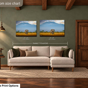a living room with a large sofa, a wooden door, and a painting of an elephant in the background. The painting is hung on the wall above the sofa, and the sofa is positioned in front of the painting.