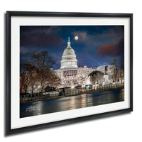 the United States Capitol building at night, with the moon visible in the sky.