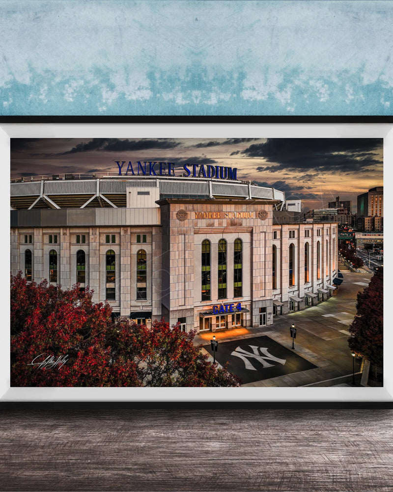 A framed photograph of Yankee Stadium, a baseball stadium in New York City, with the iconic Yankee Stadium sign prominently displayed.