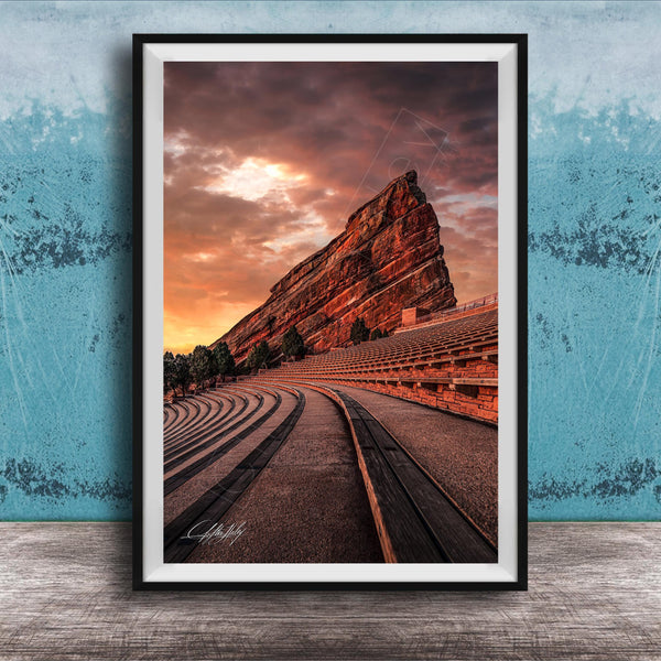 a large, steep rock formation with a dramatic sky in the background, creating a striking and visually appealing scene.