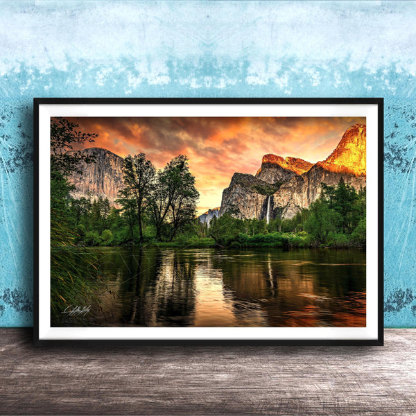 a serene landscape with a calm lake reflecting the vibrant colors of the sky, surrounded by lush greenery and towering mountains.
