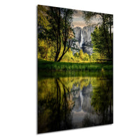 a serene landscape with a tranquil lake reflecting the surrounding trees and mountains.