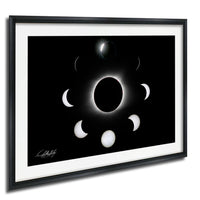 The image is a framed photograph depicting the solar eclipse, showing the moon's phases around the sun.
