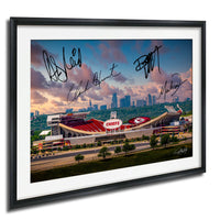 The image is a framed photograph of a football stadium with the Kansas City Chiefs logo, set against a backdrop of a city skyline and a cloudy sky.
