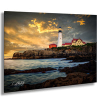 A picturesque lighthouse stands on a rocky shore, overlooking the calm ocean at sunset.