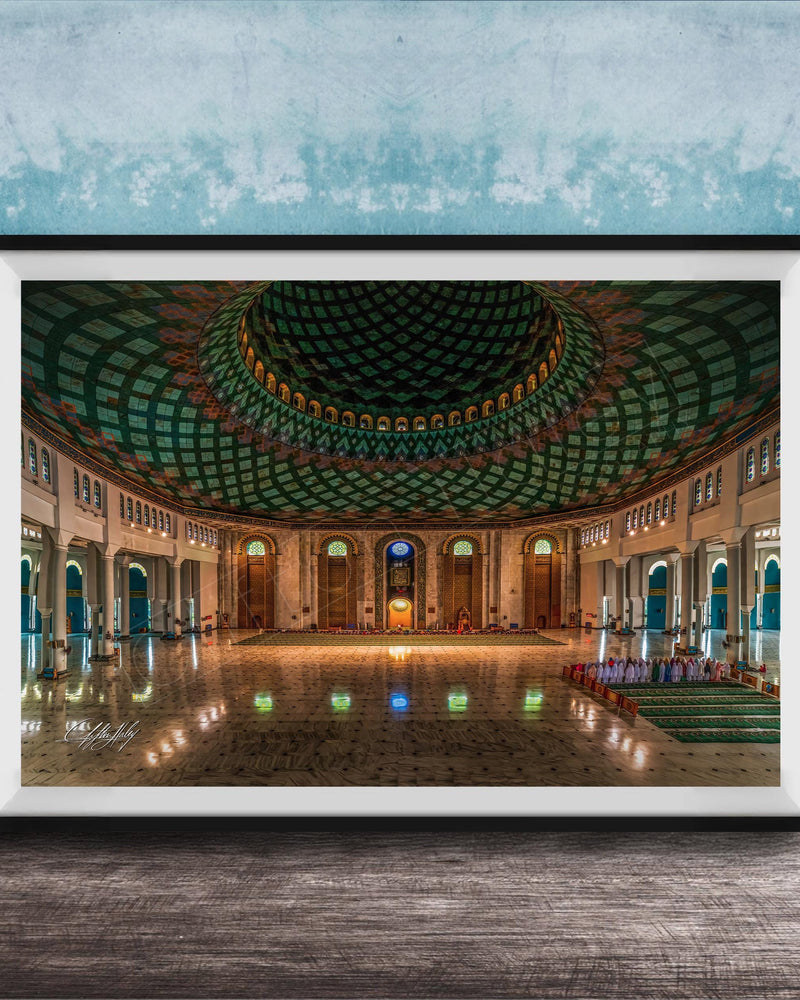 a grand, ornate mosque with a large, domed ceiling and intricate tile work. The interior features a central courtyard surrounded by arched doorways and windows, creating a sense of spaciousness and elegance.