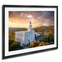 A framed photograph of the White Temple, a prominent landmark in Salt Lake City, Utah, set against a vibrant sunset sky with orange and pink hues.