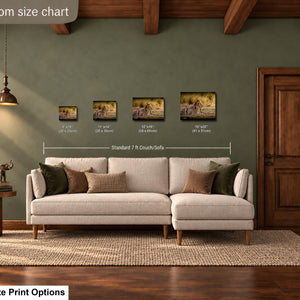 a living room with a large couch, a wooden door, and a lamp. There are three framed pictures hanging on the wall above the couch, each with different sizes and dimensions.