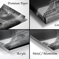four different views of a black and white photograph of the Eiffel Tower, with each view labeled as either "Premium Paper", "Canvas Wrap", "Acrylic", or "Metal/Aluminum".