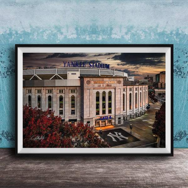 A framed photograph of Yankee Stadium, a baseball stadium in New York City, with the iconic Yankee Stadium sign prominently displayed.