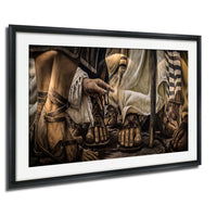 The image is a framed painting depicting a scene with a group of people wearing sandals, possibly from an ancient civilization.
