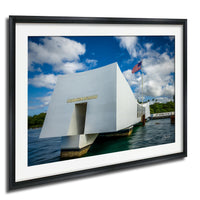 the memorial at Pearl Harbor, Hawaii, with the American flag flying in the background.