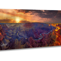 a breathtaking view of the Grand Canyon, with its vibrant colors and dramatic landscape. The sun is setting over the canyon, casting a warm glow on the scene and highlighting the natural beauty of the area. The canyon itself is a stunning display of rock formations and valleys, showcasing the geological history of the region. The image is a captivating representation of the Grand Canyon's grandeur and the magnificence of nature.