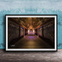a long, dimly lit tunnel with a wooden floor and walls, creating a sense of depth and mystery.