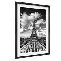 The image is a black and white photograph of the Eiffel Tower in Paris, France.