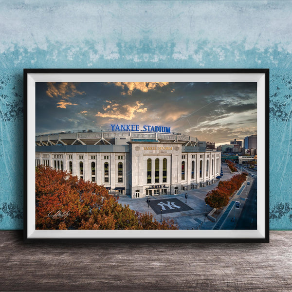 A framed photograph of Yankee Stadium, a baseball stadium located in New York City, with the stadium's name prominently displayed on the exterior.