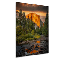 a serene mountain landscape with a river flowing through it, surrounded by lush greenery and towering cliffs bathed in the warm glow of a sunset.